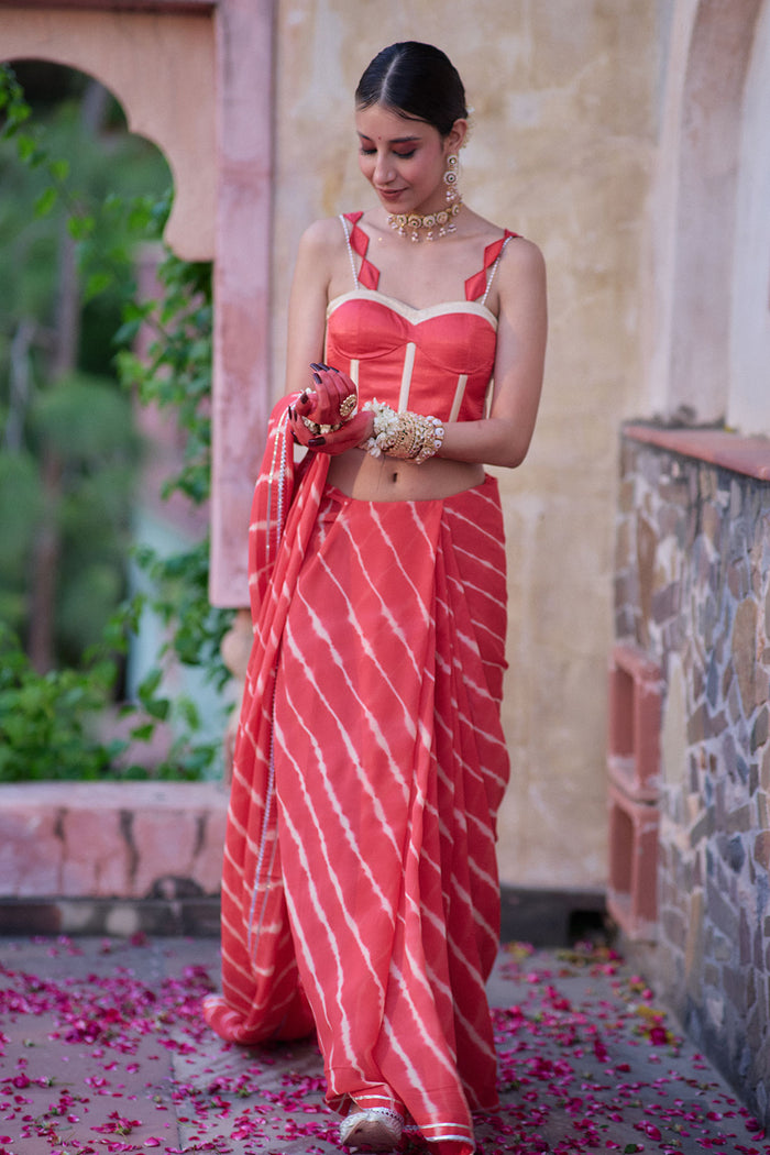 Tarangini – Watermelon Leheriya Saree and Corset Blouse with Pearl Strings