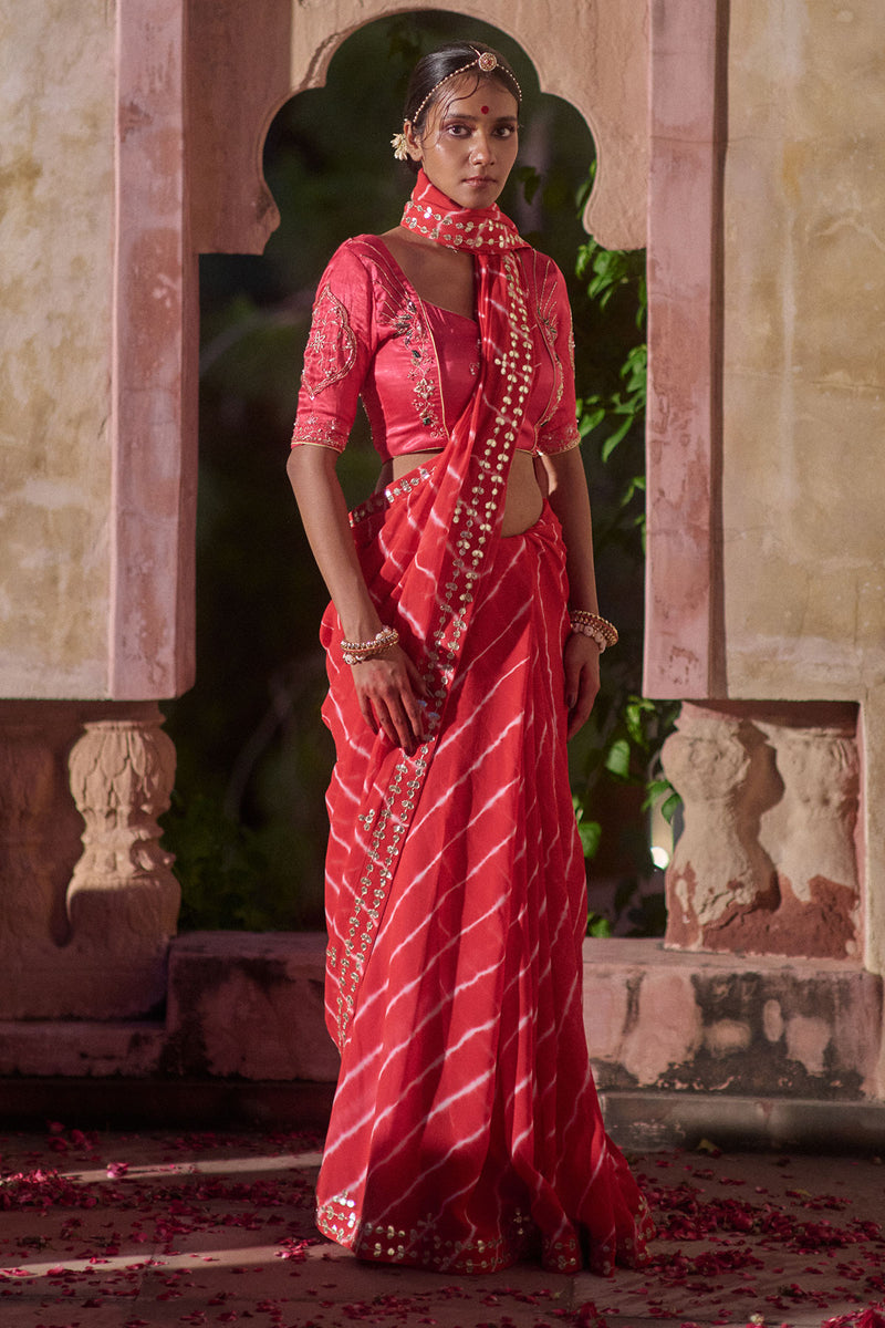 Rajlakshmi  – Red Leheriya Saree with Rani Pink  Blouse