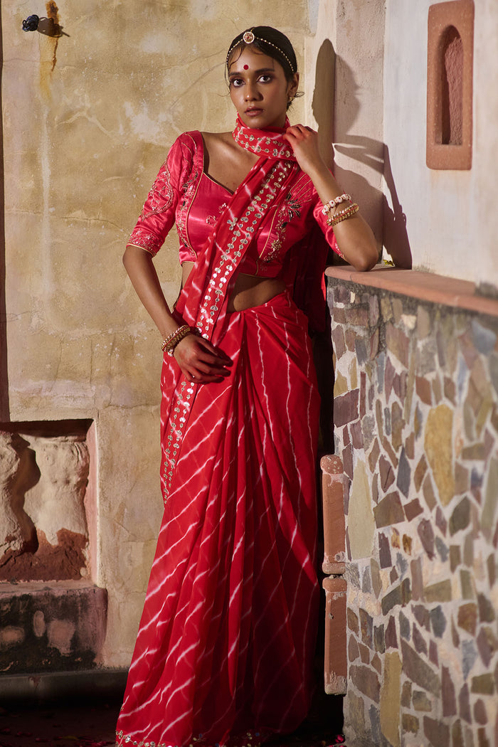 Rajlakshmi  – Red Leheriya Saree with Rani Pink  Blouse