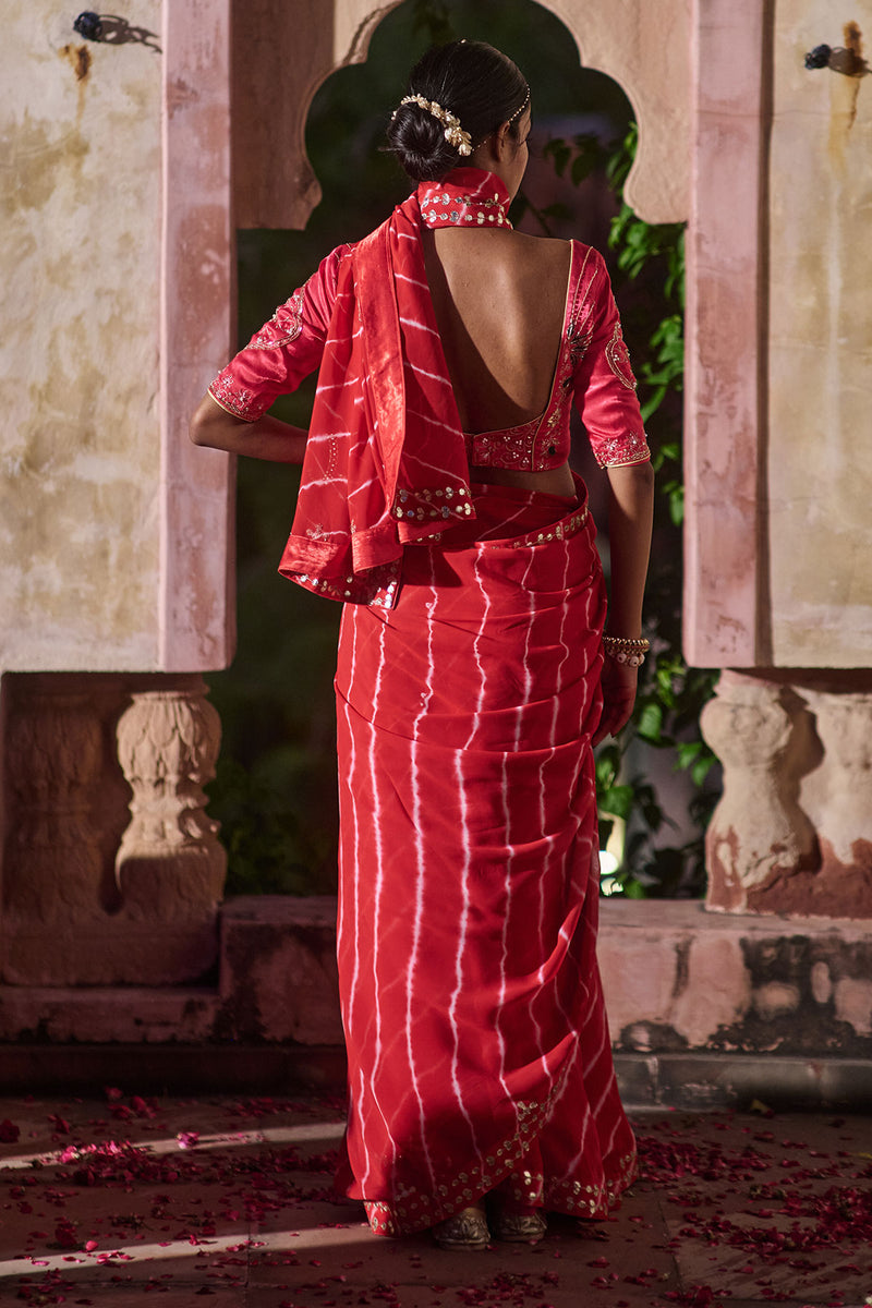 Rajlakshmi  – Red Leheriya Saree with Rani Pink  Blouse